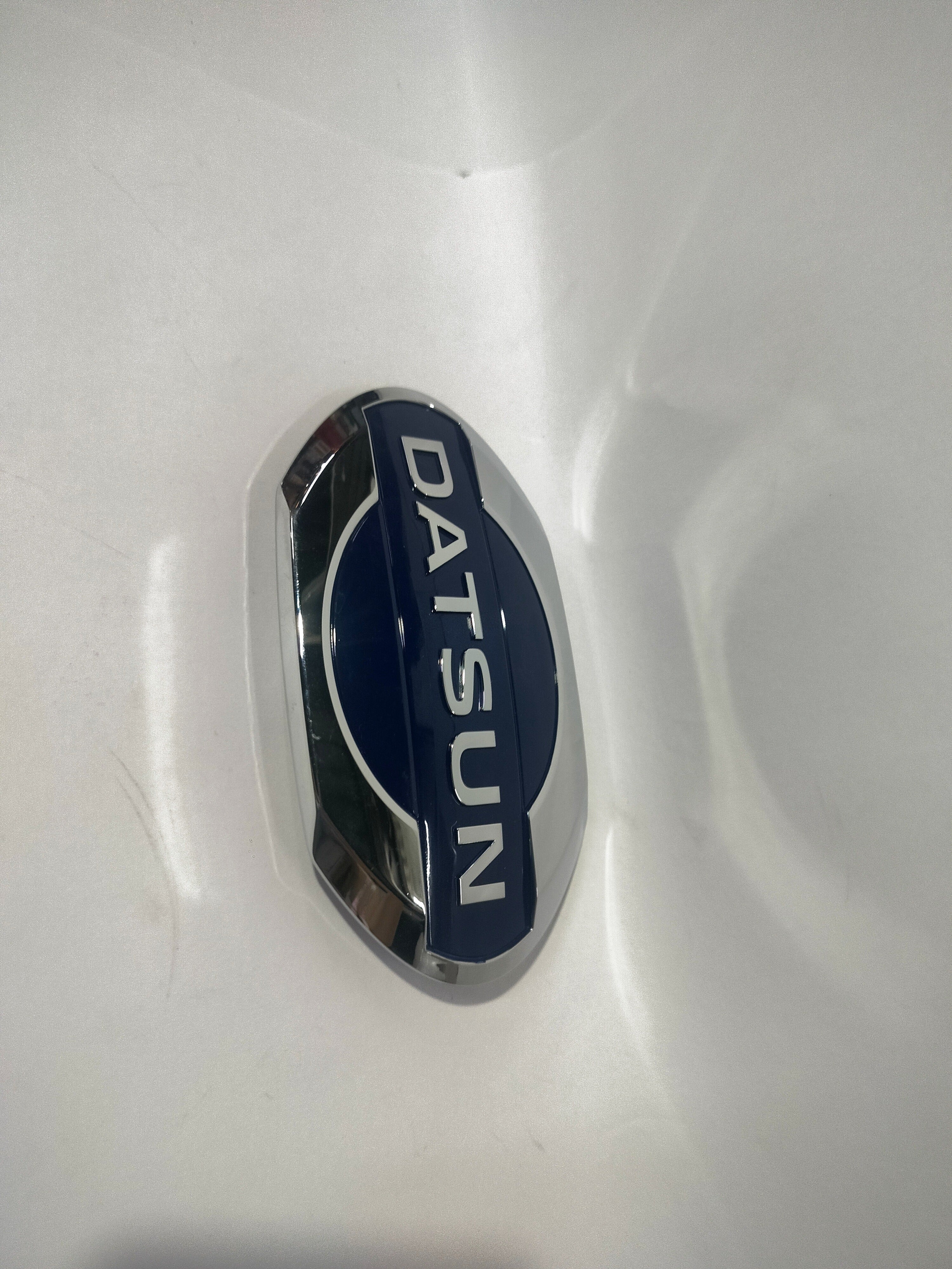 NISSAN Emblem | Datsun Go | Front | #628904LA0A 628904LA0A - Front view