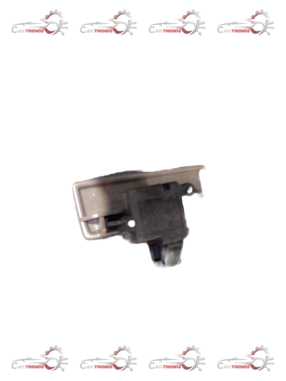 Maruti Suzuki beige lock grove box with key, compact storage for vehicle accessories or small items.