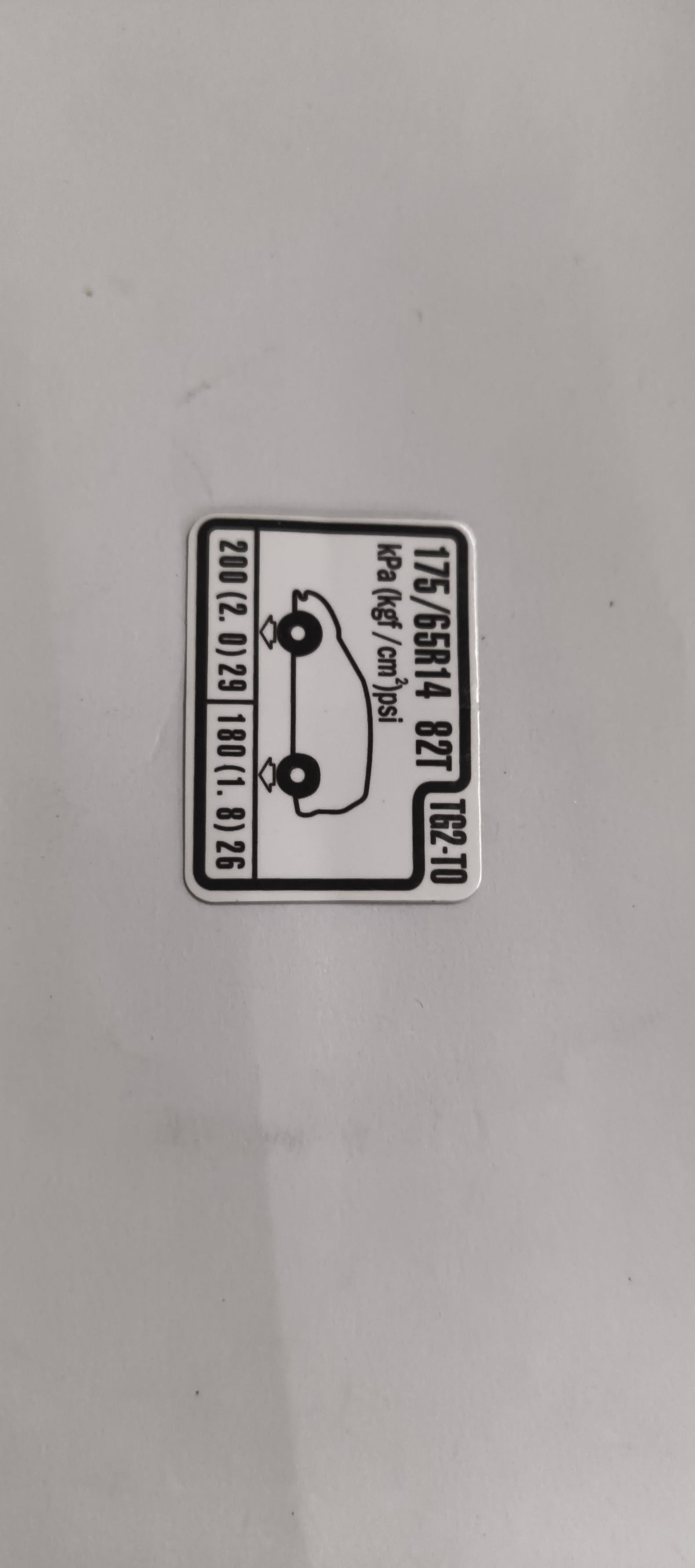 HONDA CAUTION PLATE.(TIRE PRESSURE) 42760TG2T00 42760TG2T00 - Back view