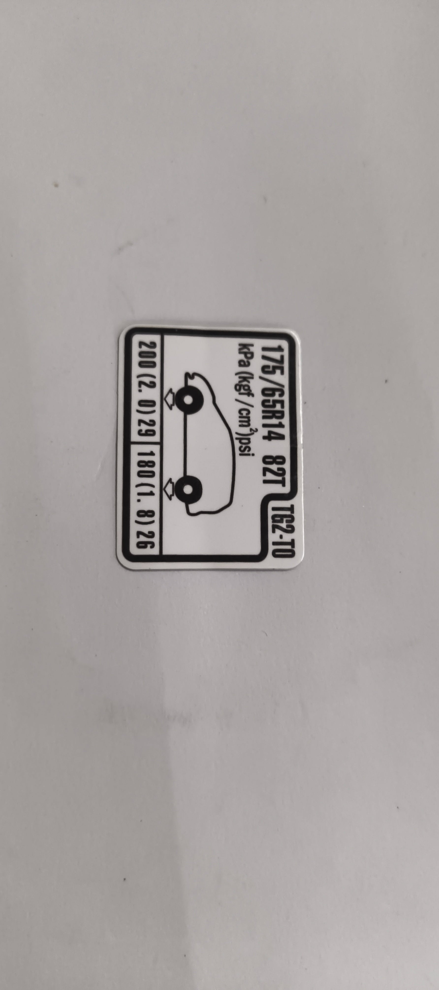 HONDA CAUTION PLATE.(TIRE PRESSURE) 42760TG2T00 42760TG2T00 - Back view