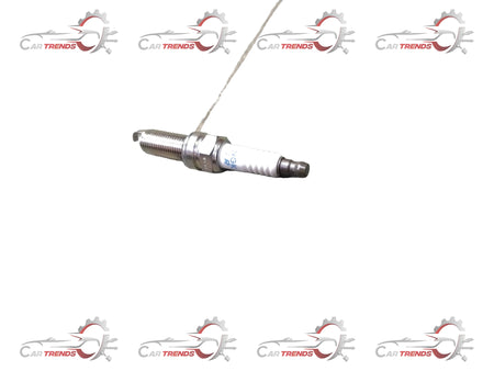 Maruti Suzuki spark plug for Celerio new model, part number 09482M00651, showing the metal electrode and ceramic insulator.