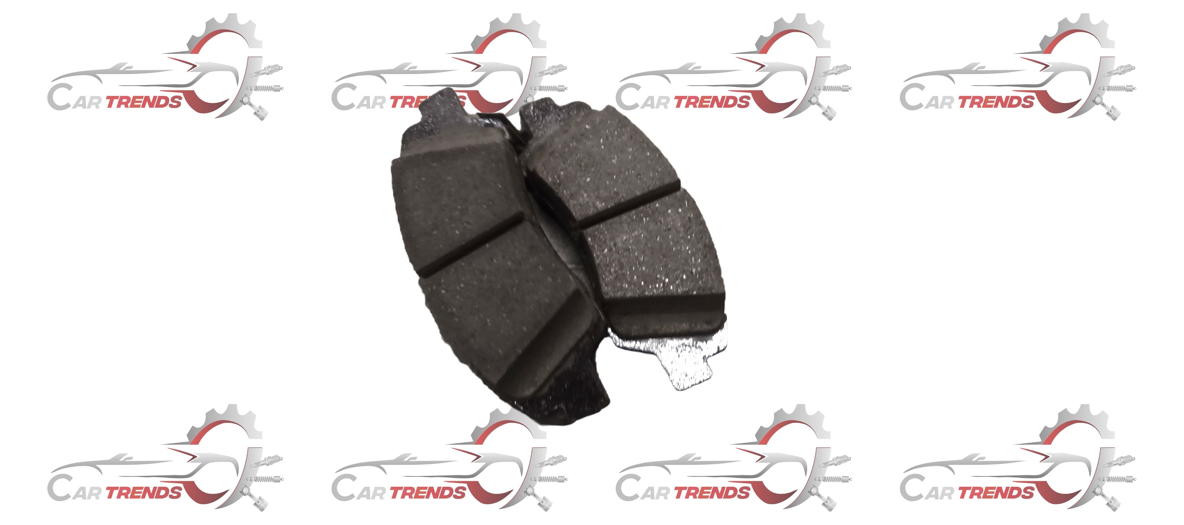 Front brake pad by CarTrends, spare parts for vehicle, showing the black friction surface and metal backing in close-up.