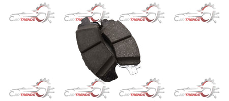 Front brake pad by CarTrends, spare parts for vehicle, showing the black friction surface and metal backing in close-up.