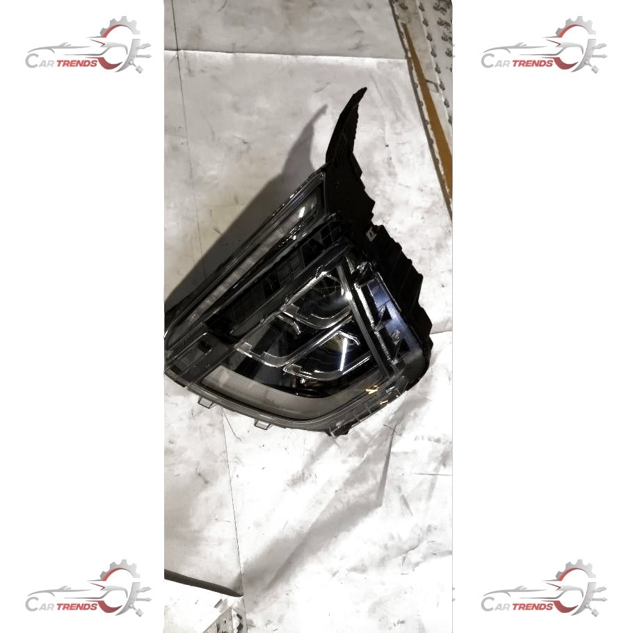Hyundai headlamp assembly model 92101BV100 showing the front view of the headlight unit with clear lens and reflective interior.
