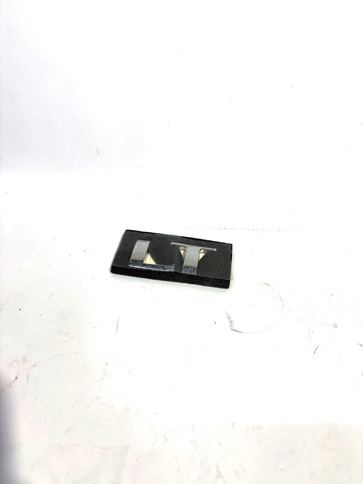 GENERAL MOTORS NAME PLATE LT TAVERA T97595824 T97595824 - Back view
