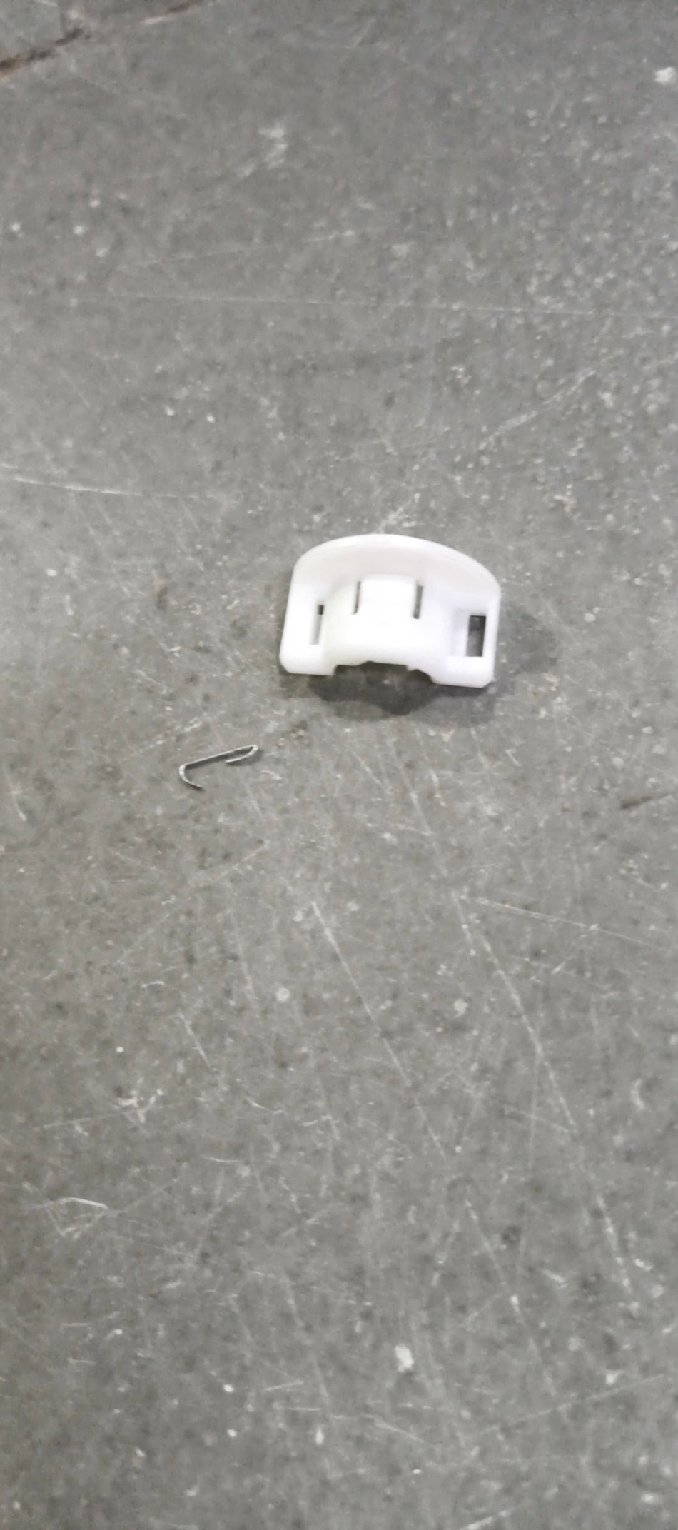 Honda Amaze attaching piece part 36751T2AA01, automotive component for vehicle assembly, shown in the image.