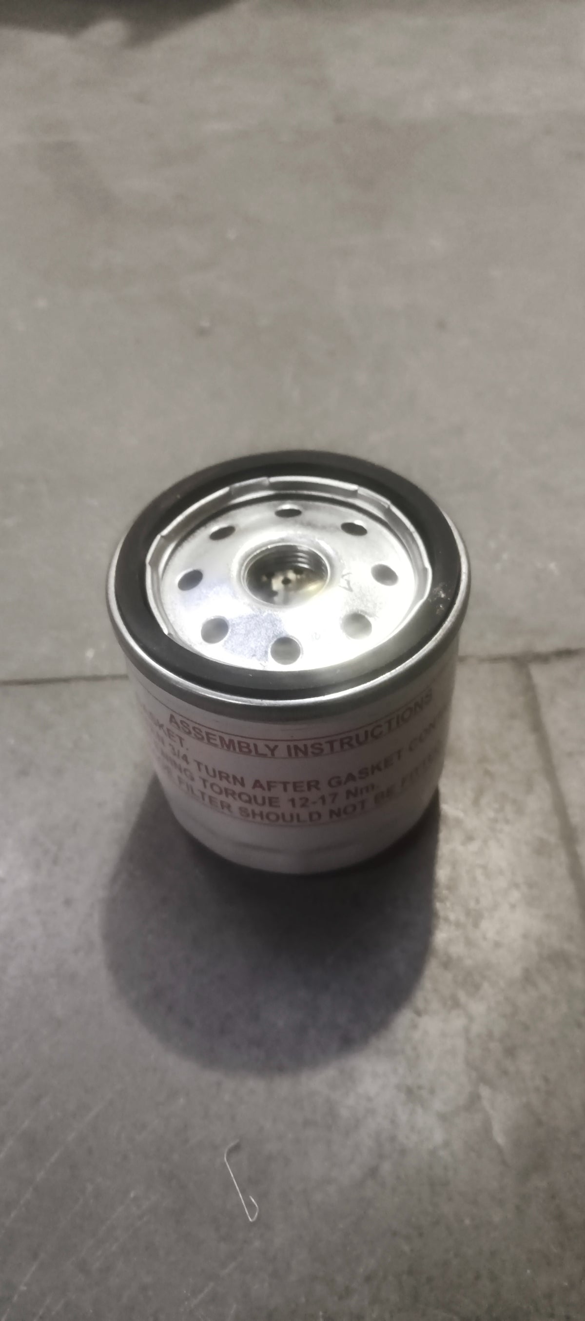 Ford EcoSport oil filter model 7S7Z6731E, automotive engine oil filter with black rubber seals and metal body.