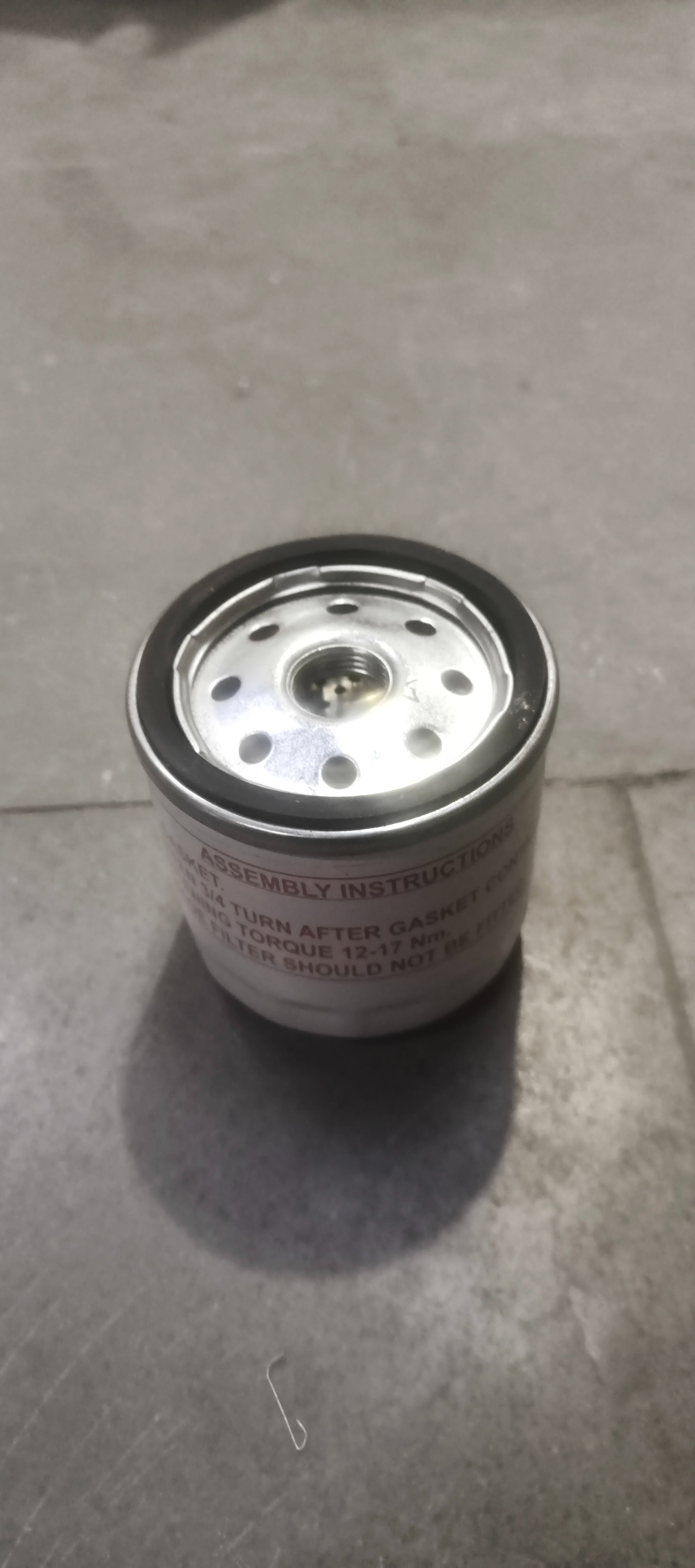 Ford EcoSport oil filter model 7S7Z6731E, automotive engine oil filter with black rubber seals and metal body.