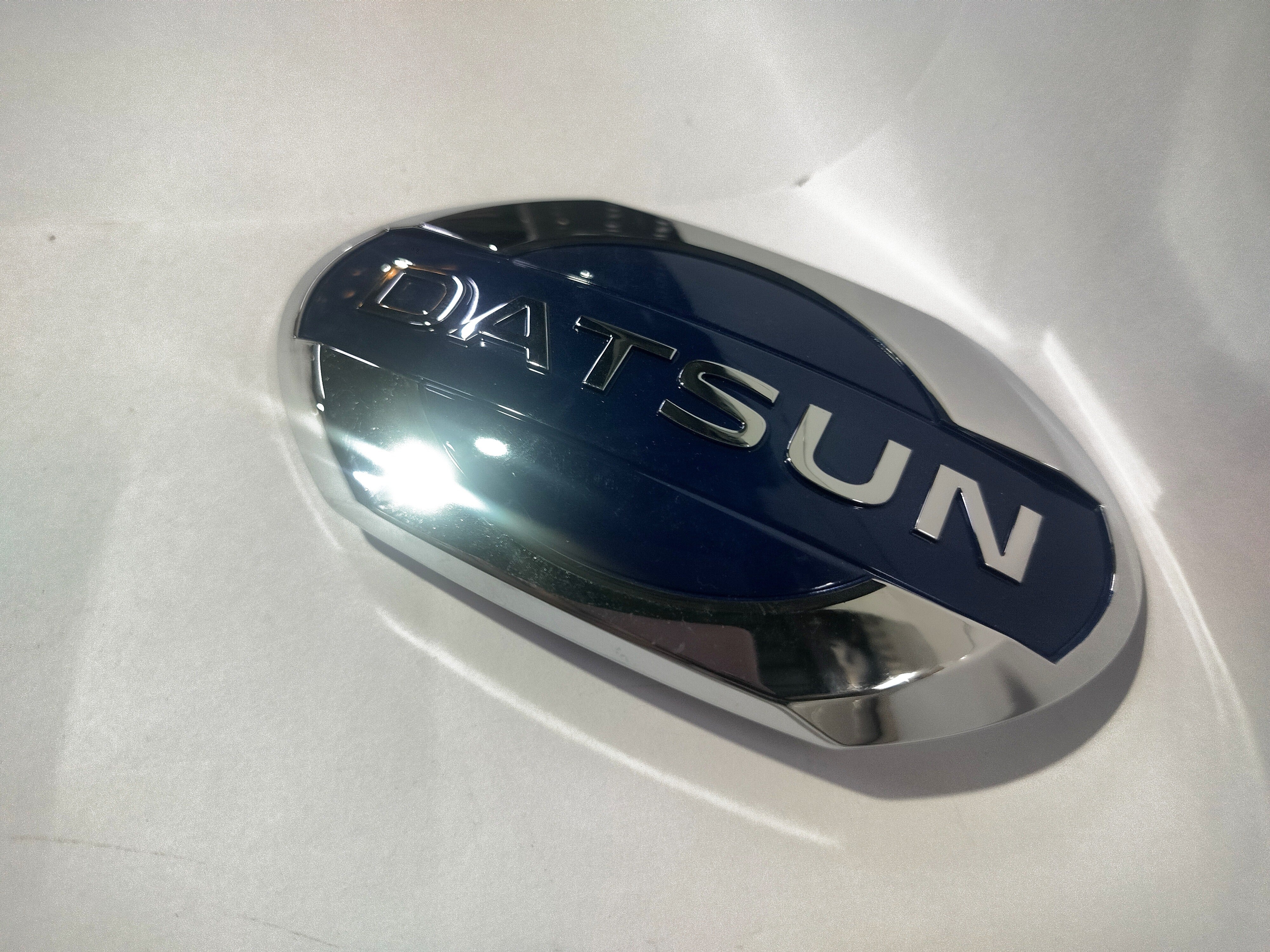 NISSAN Emblem | Datsun Go | Front | #628904LA0A 628904LA0A - Back view