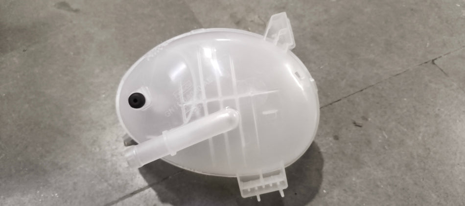 Ford Figo radiator overflow tank assembly, showing the black plastic tank with inlet and outlet connectors.