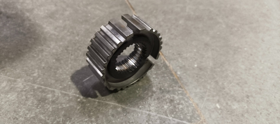 Maruti Suzuki HUBLOW SPEED SYNC 24411M67K00 automotive part, showing a close-up of the component with metal and plastic elements.
