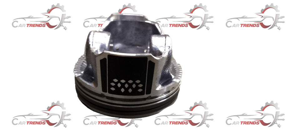 Maruti Suzuki piston 12111M52T00 showing a metallic engine piston with brand markings and detailed surface texture.