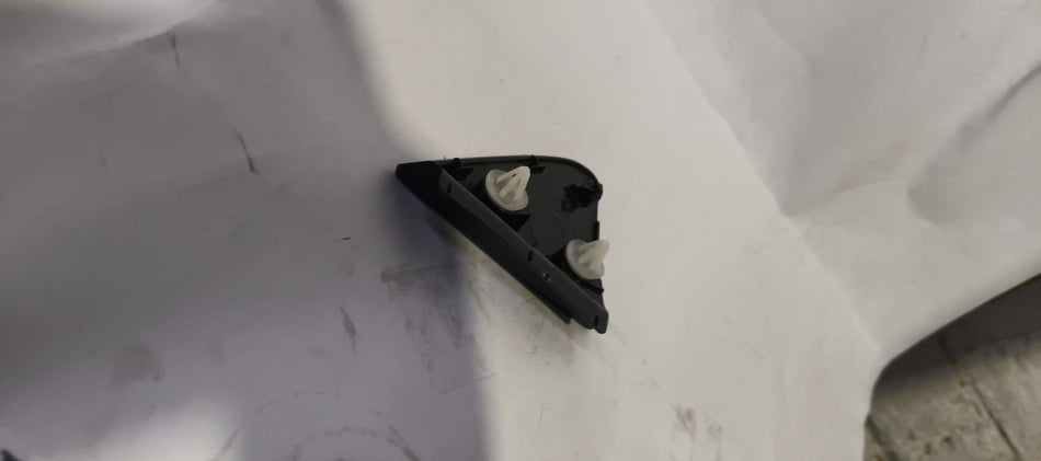 Maruti Suzuki garnish for pillar outer left side, part number 77190M60M005, in a close-up view showing its shape and surface details.