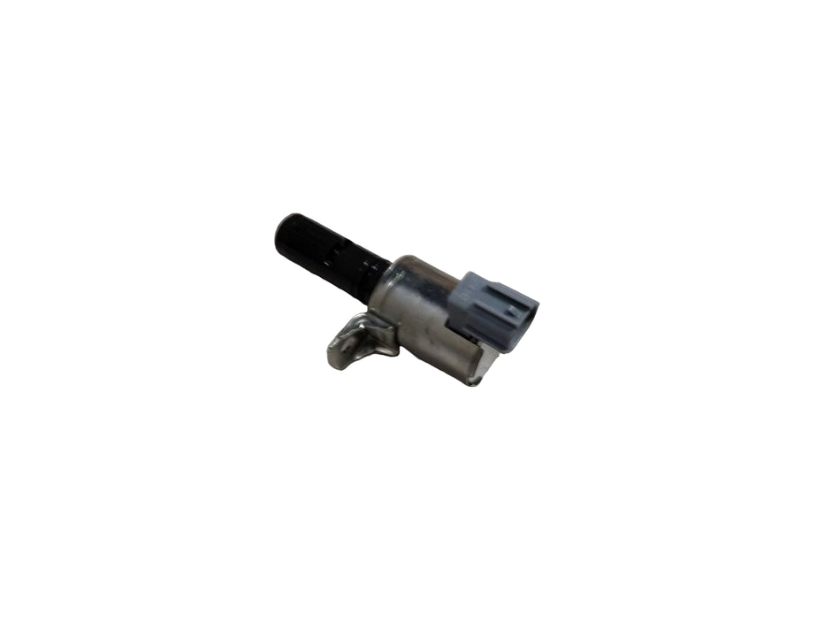 Ford Aspire Fiesta variable timing engine component, showing metal parts and connectors for engine timing adjustment.