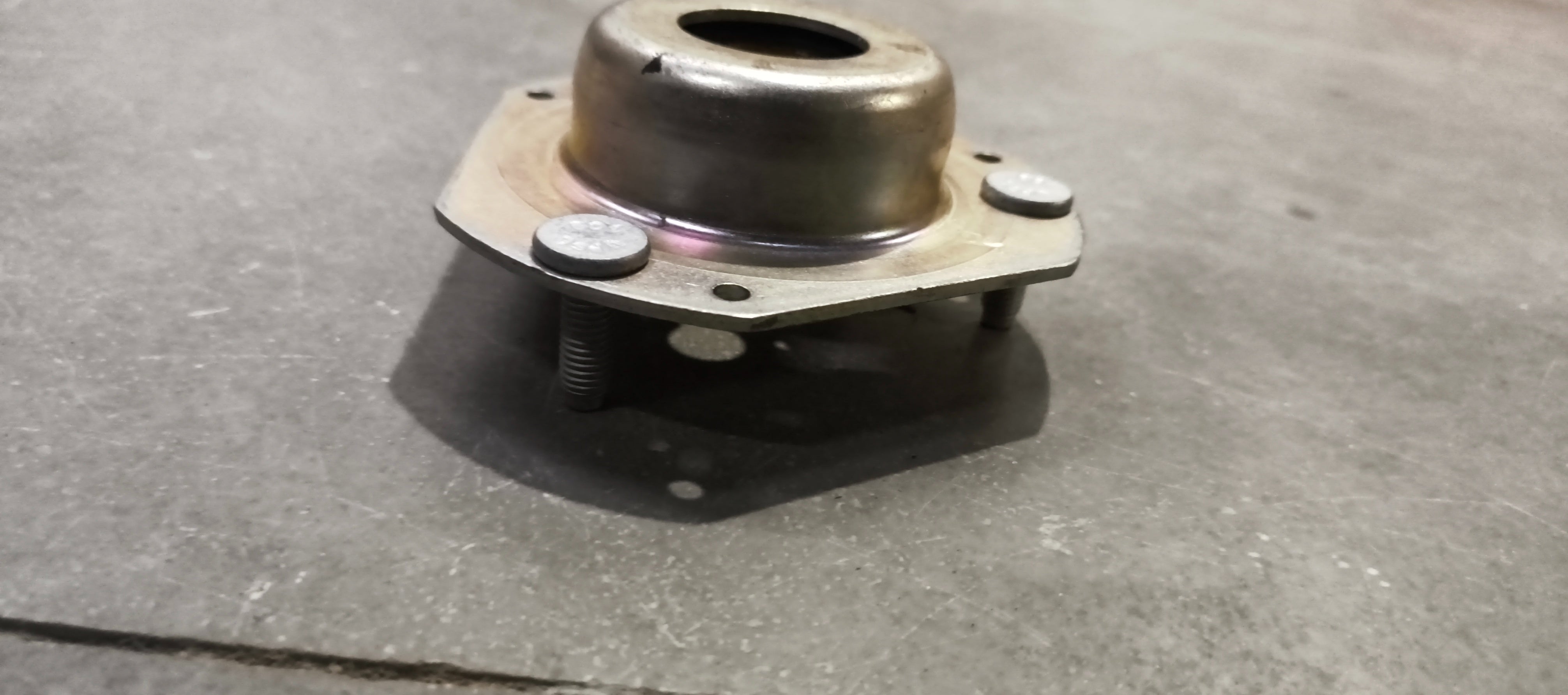 Ford mounting assembly E4BZ3A197A, automotive engine or body mount part, shown in the image with metal brackets and mounting points