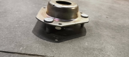 Ford mounting assembly E4BZ3A197A, automotive engine or body mount part, shown in the image with metal brackets and mounting points