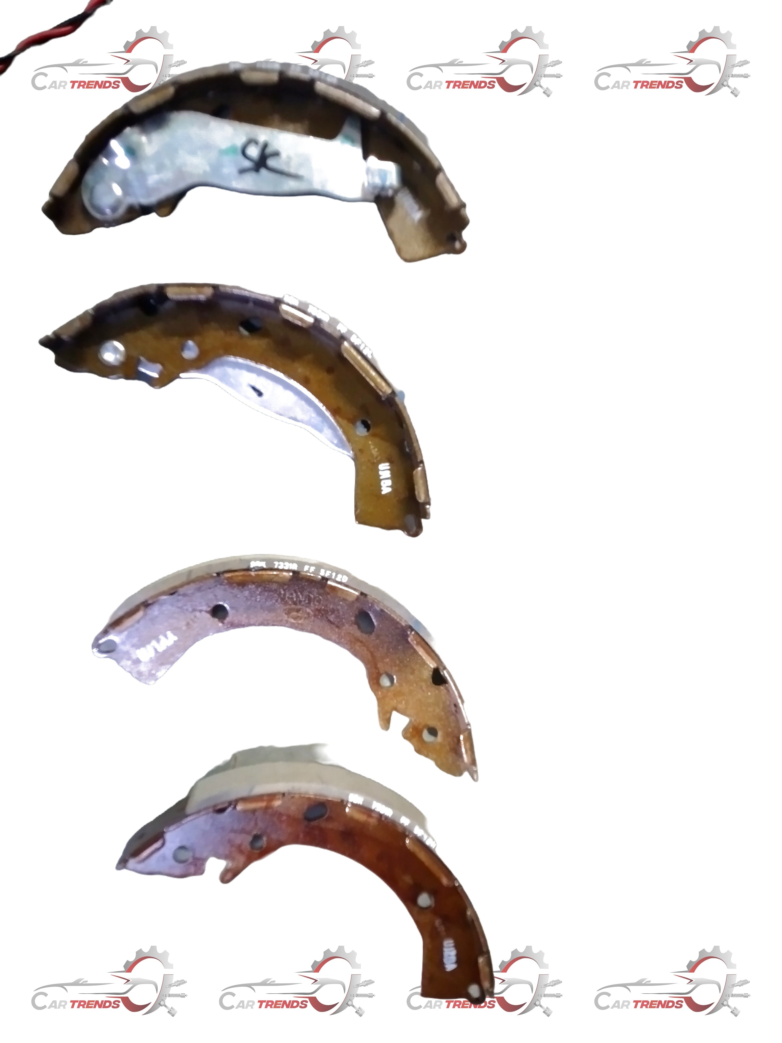 Hyundai CarTrends parking brake shoe set for Grand i10, showing the new brake shoes with metal components and friction surfaces.