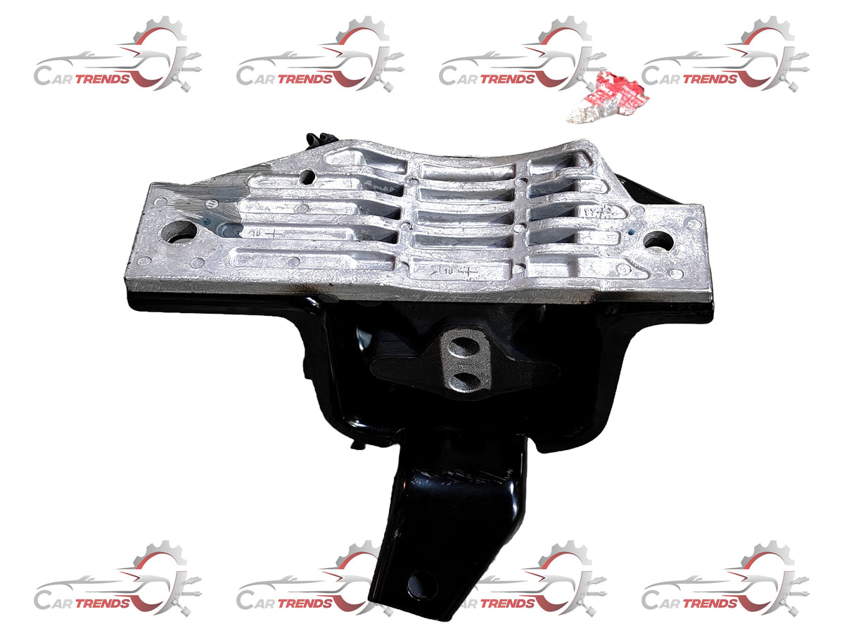Hyundai Grand i10 transmission mounting part, showing the metal bracket and rubber components for engine stability.