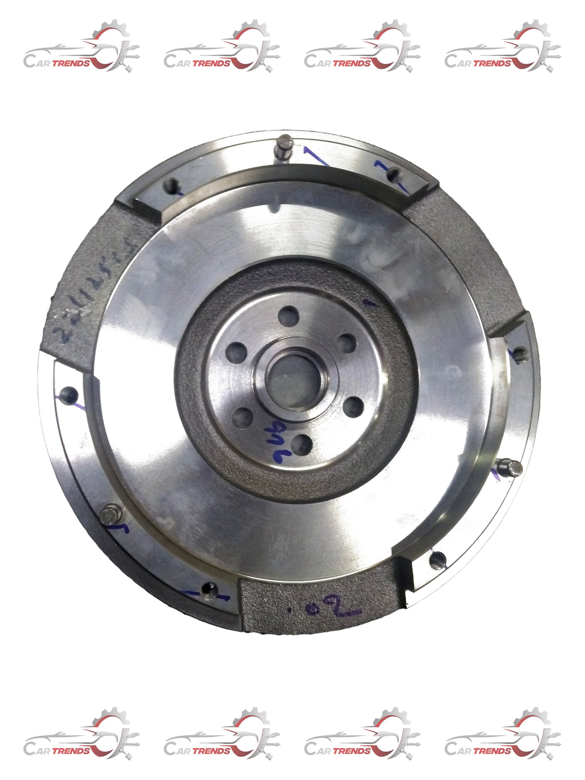 Maruti Suzuki flywheel component with part number 12620M68K12, showing the metal wheel with gear teeth and mounting holes.