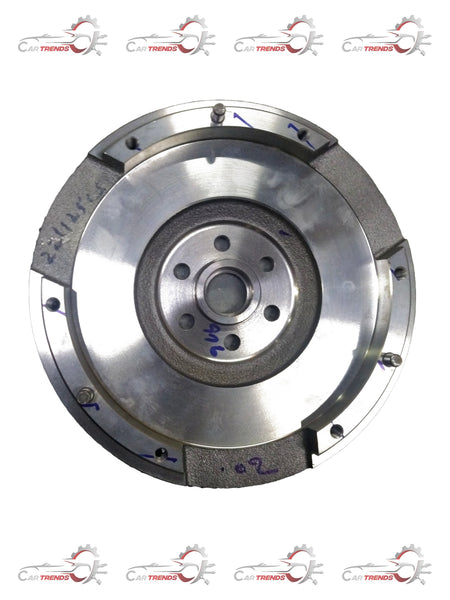 Maruti Suzuki flywheel component with part number 12620M68K12, showing the metal wheel with gear teeth and mounting holes.