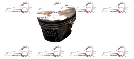 Maruti Suzuki piston 12111M54T00 showing metallic cylindrical engine part with precision machining details