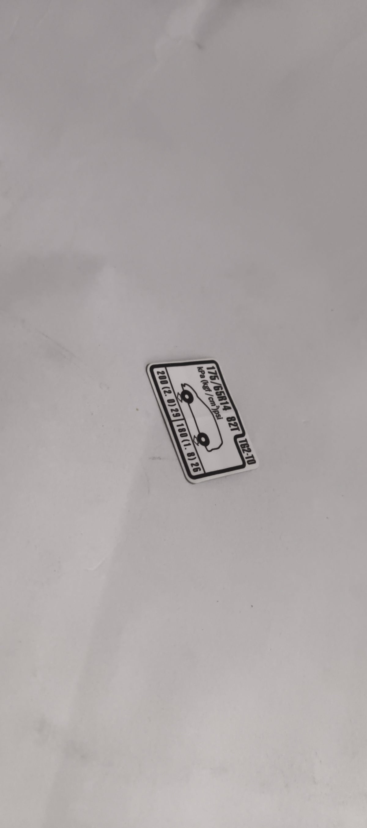 HONDA CAUTION PLATE.(TIRE PRESSURE) 42760TG2T00 42760TG2T00 - Left view