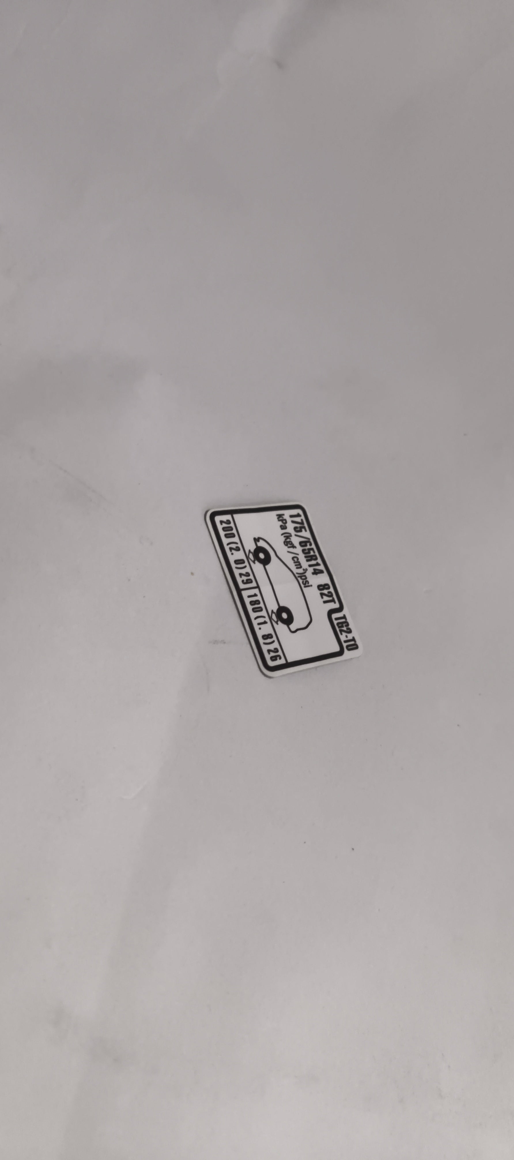 HONDA CAUTION PLATE.(TIRE PRESSURE) 42760TG2T00 42760TG2T00 - Left view
