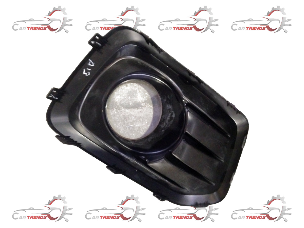 Maruti Suzuki fog lamp bezel front part, model 71751M85S205PK, showing the black plastic frame and mounting details.