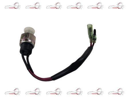 CarTrends reverse lamp switch for Chevrolet Tavera, showing the small, black spare part with electrical connectors.