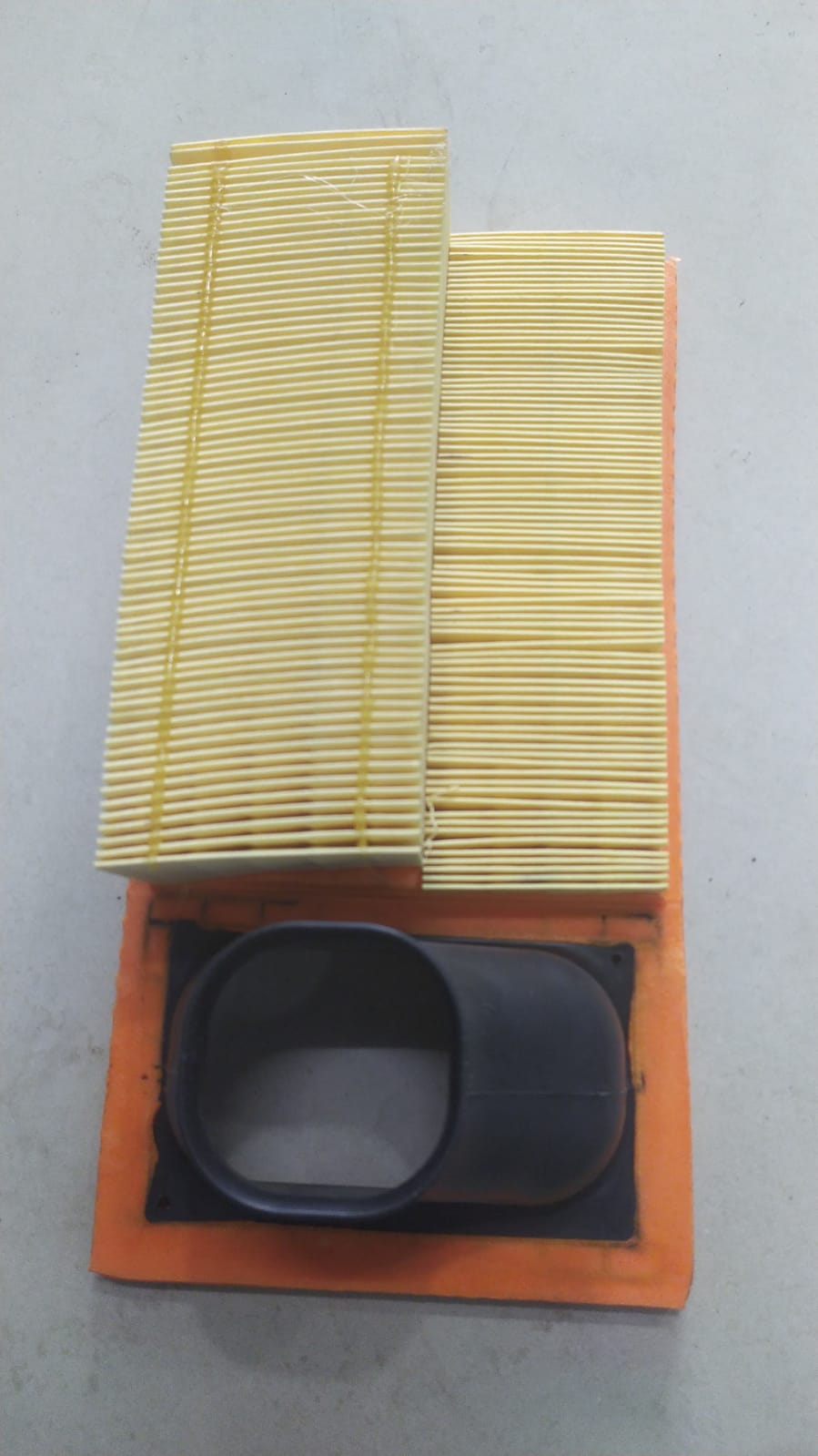 Tata Tiago air filter spare part with model number 571509130105, shown as a clean, new automotive air filter.
