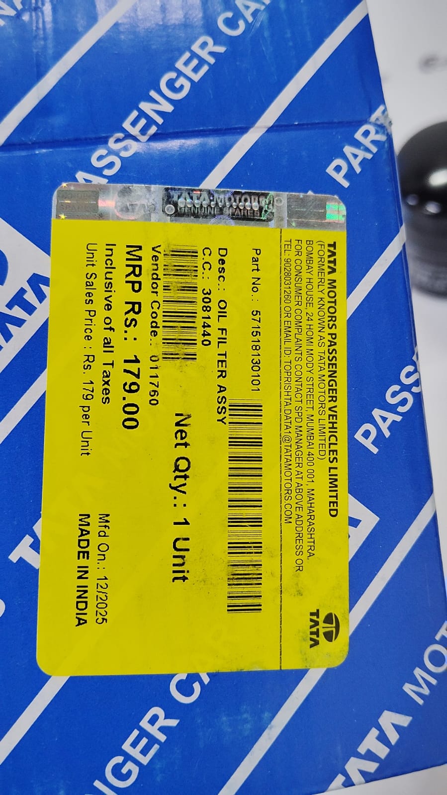TATA Punch oil filter spare part with model number 571518130101, close-up view showing the filter's details and branding.