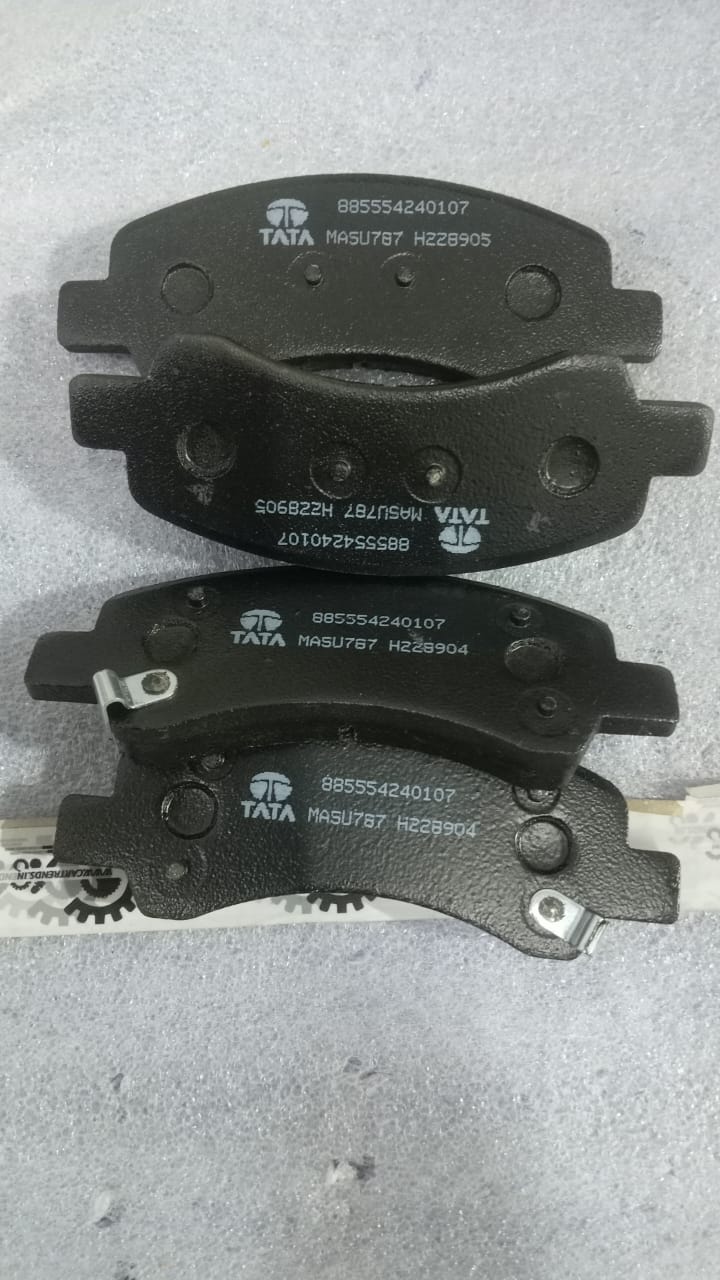 TATA brake pad kit for Tata Tiago and Tigor front brakes, showing new brake pads and assembly components.