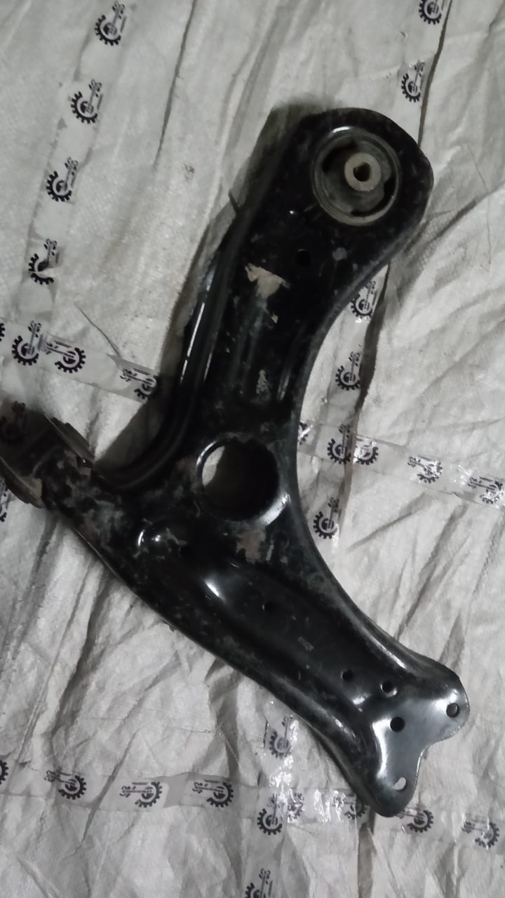 Volkswagen Polo control arm, left side, OEM part #6R0407151E, shown in natural metal finish with mounting points visible