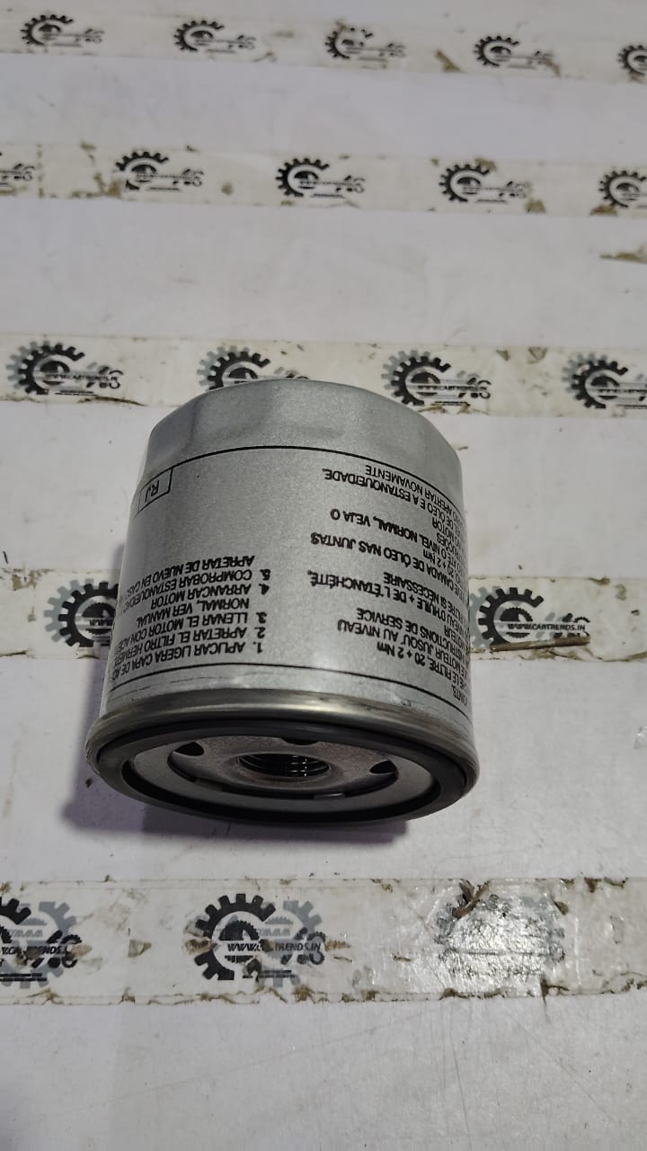 Volkswagen oil filter for Kushaq with part number 04E115561AC, shown in a close-up view of the filter element.
