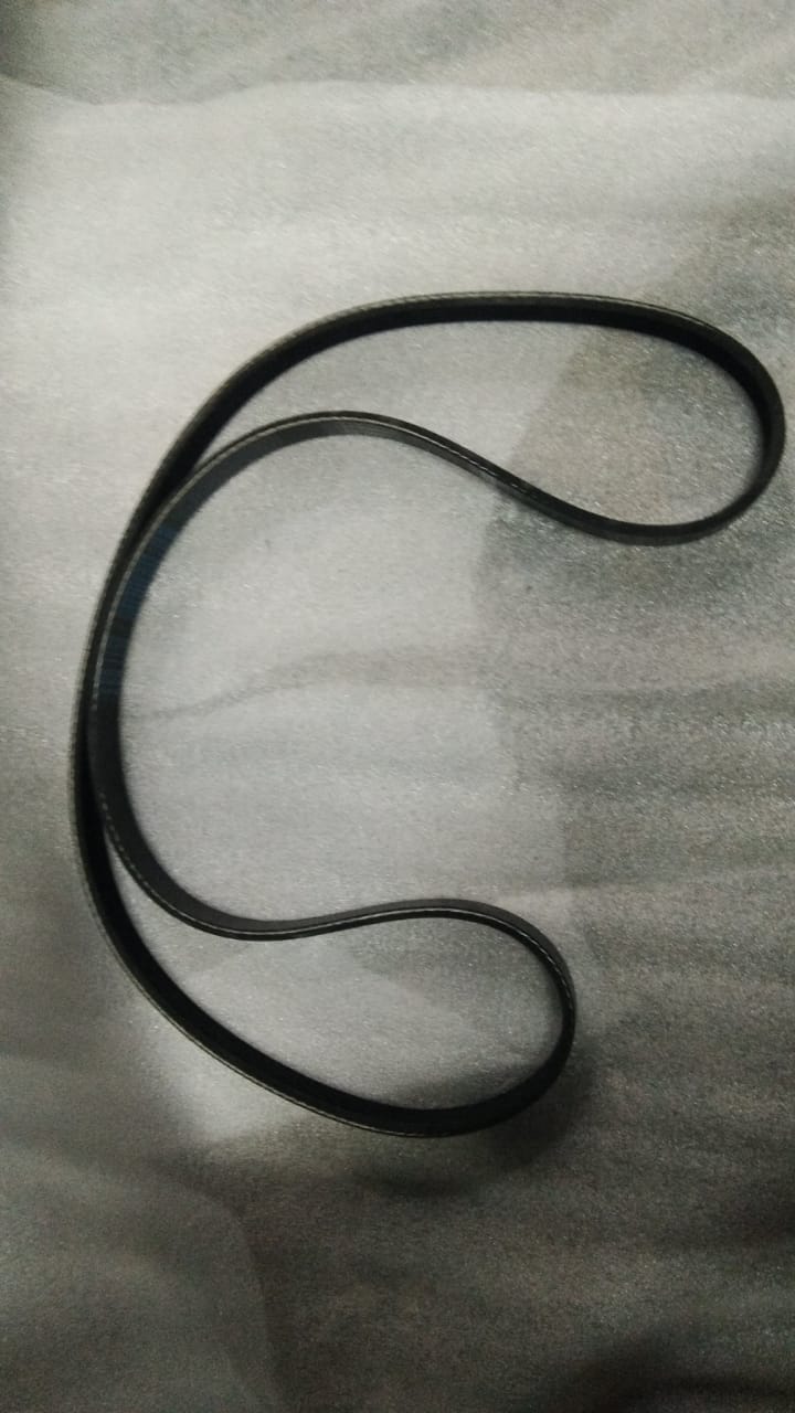 Aftermarket fan belt for Honda City, model #5PK1135, showing the black rubber belt with branded markings and tensioning features.