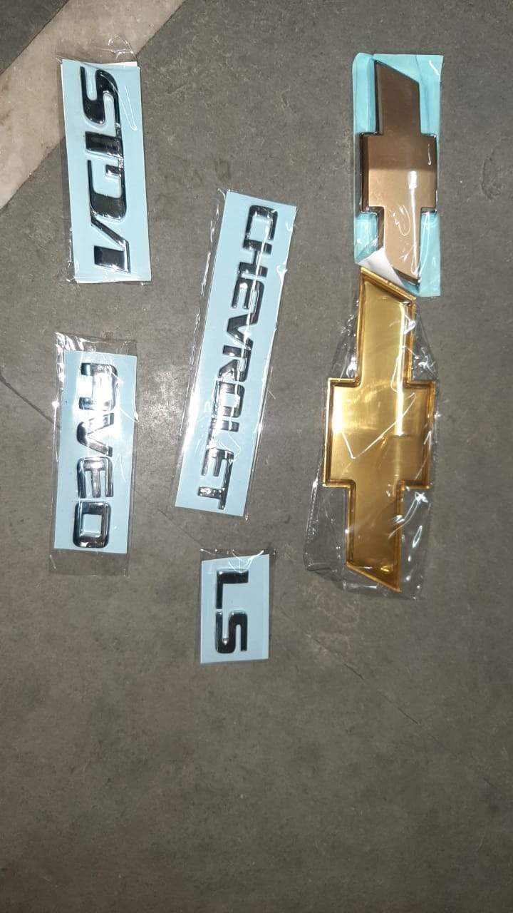 Aftermarket Chevrolet Aveo monogram set with custom lettering, designed for vehicle customization and branding.