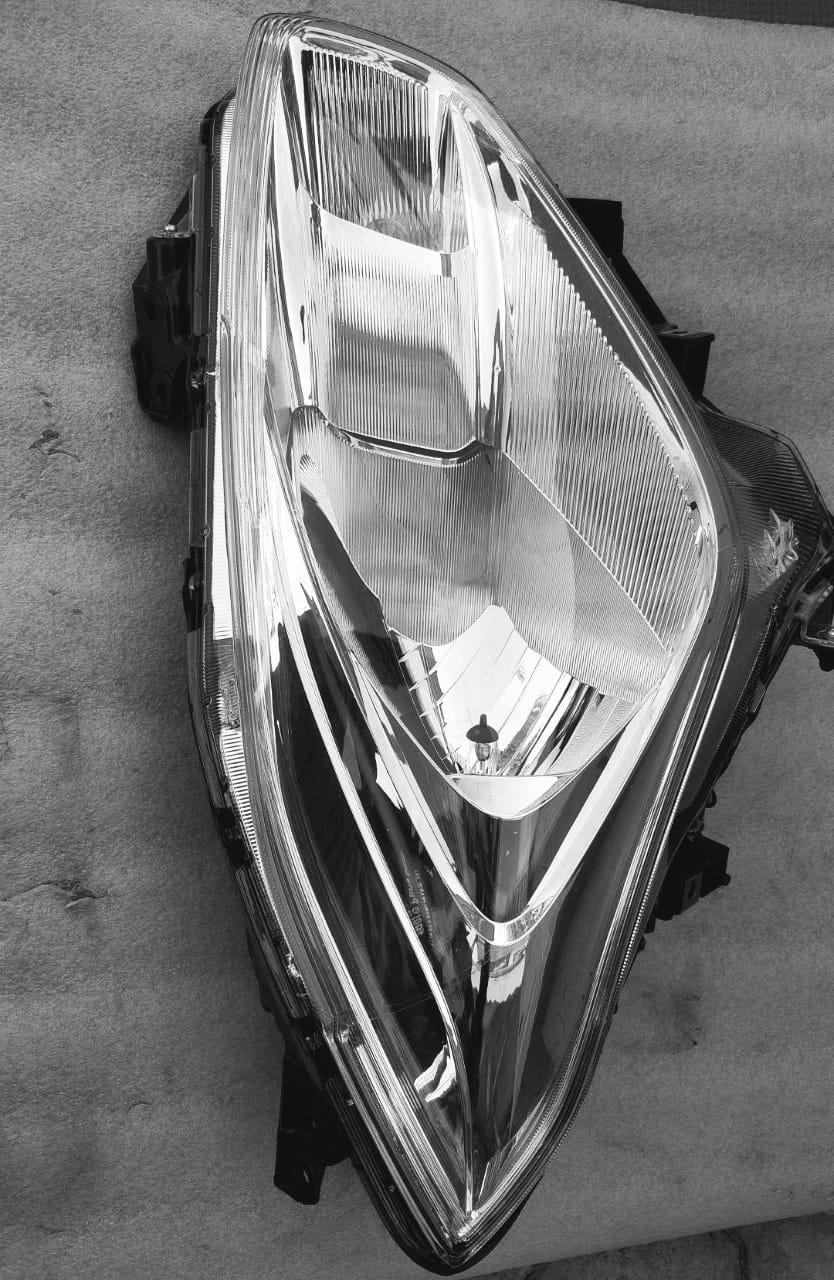 Maruti Suzuki headlamp assembly by CarTrends, model 35100M55R10, showing the front view of the car's headlight.