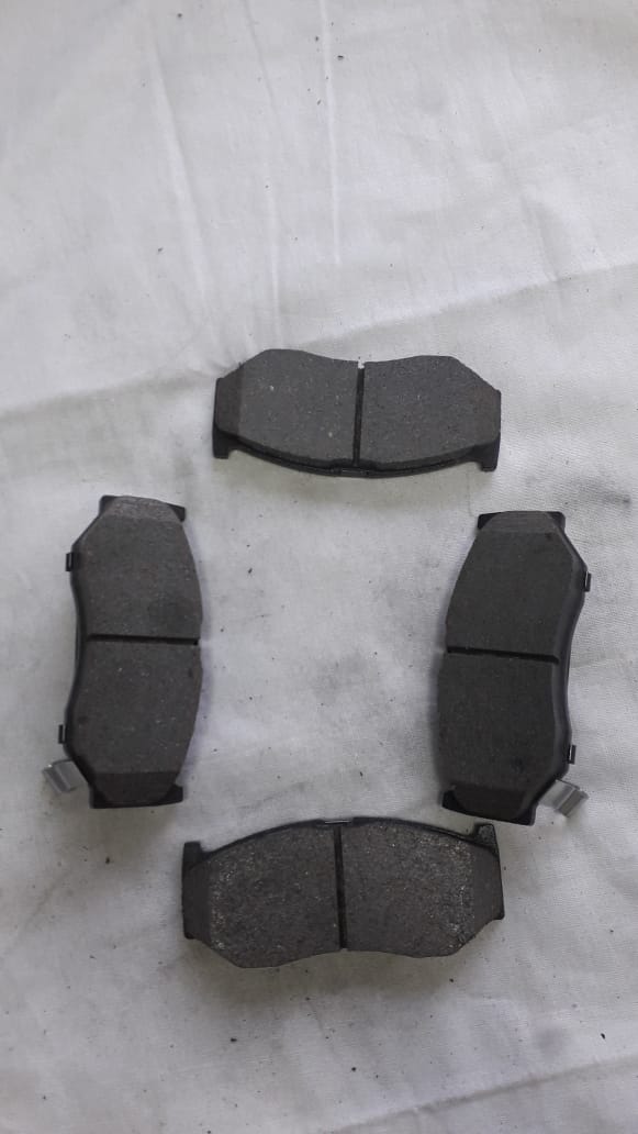 CarTrends front brake pad for Baleno, automotive spare part showing new brake pad with metal backing and friction surface.