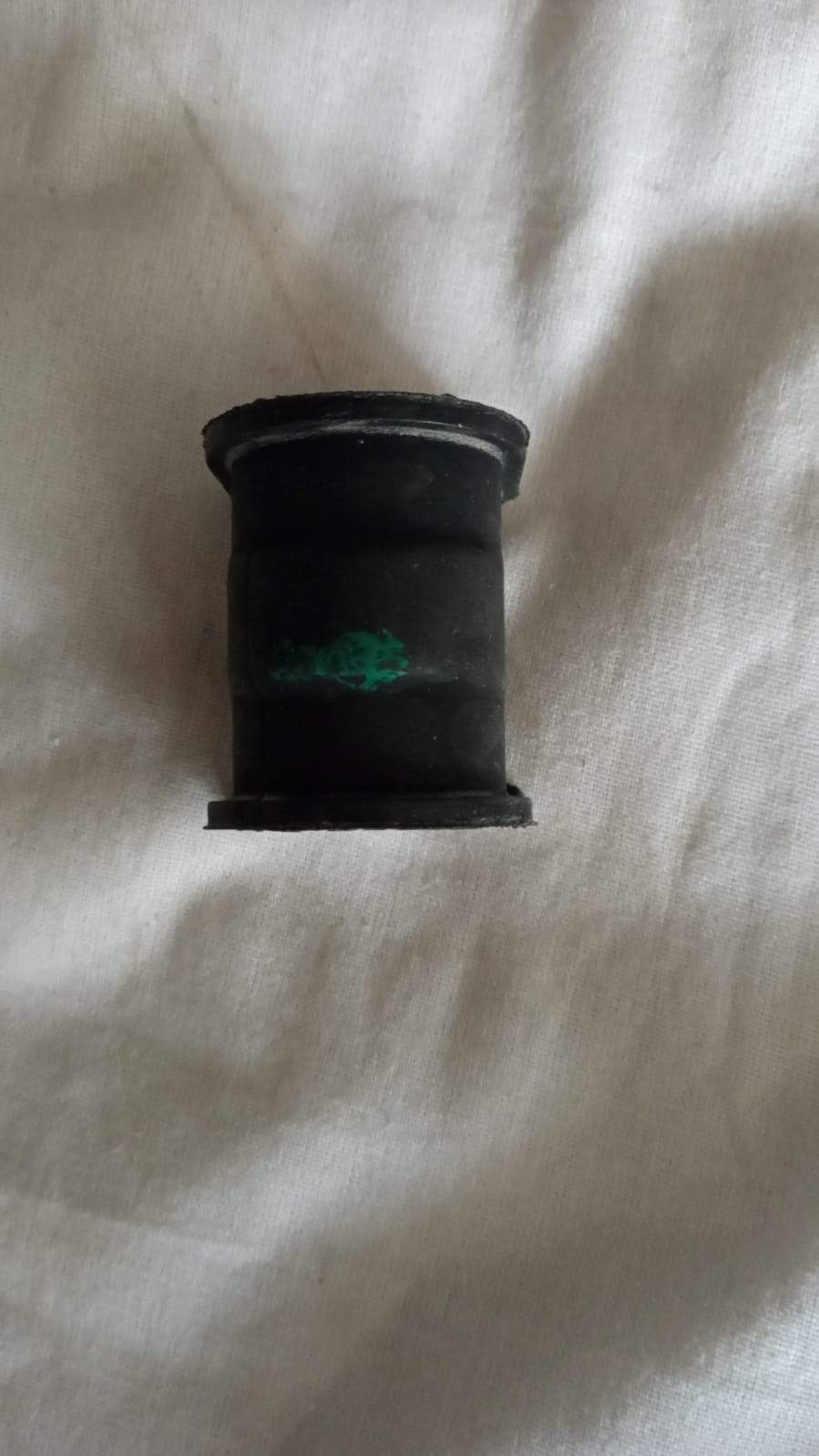 CarTrends Jumping Rod Bush for Baleno, spare part used in vehicle suspension, shown in black rubber with metal components.
