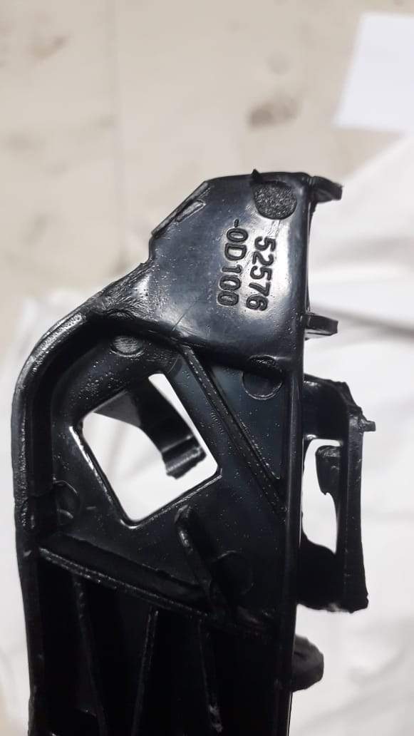 Rear bumper retainer for Toyota Yaris, LH side, CarTrends spare part, shown mounted on vehicle rear.