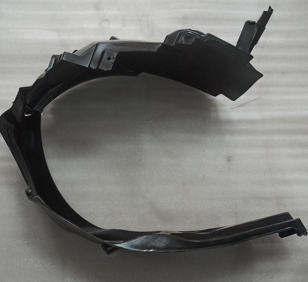 CarTrends left side fender lining for Ertiga, automotive spare part showing the black plastic fender liner.