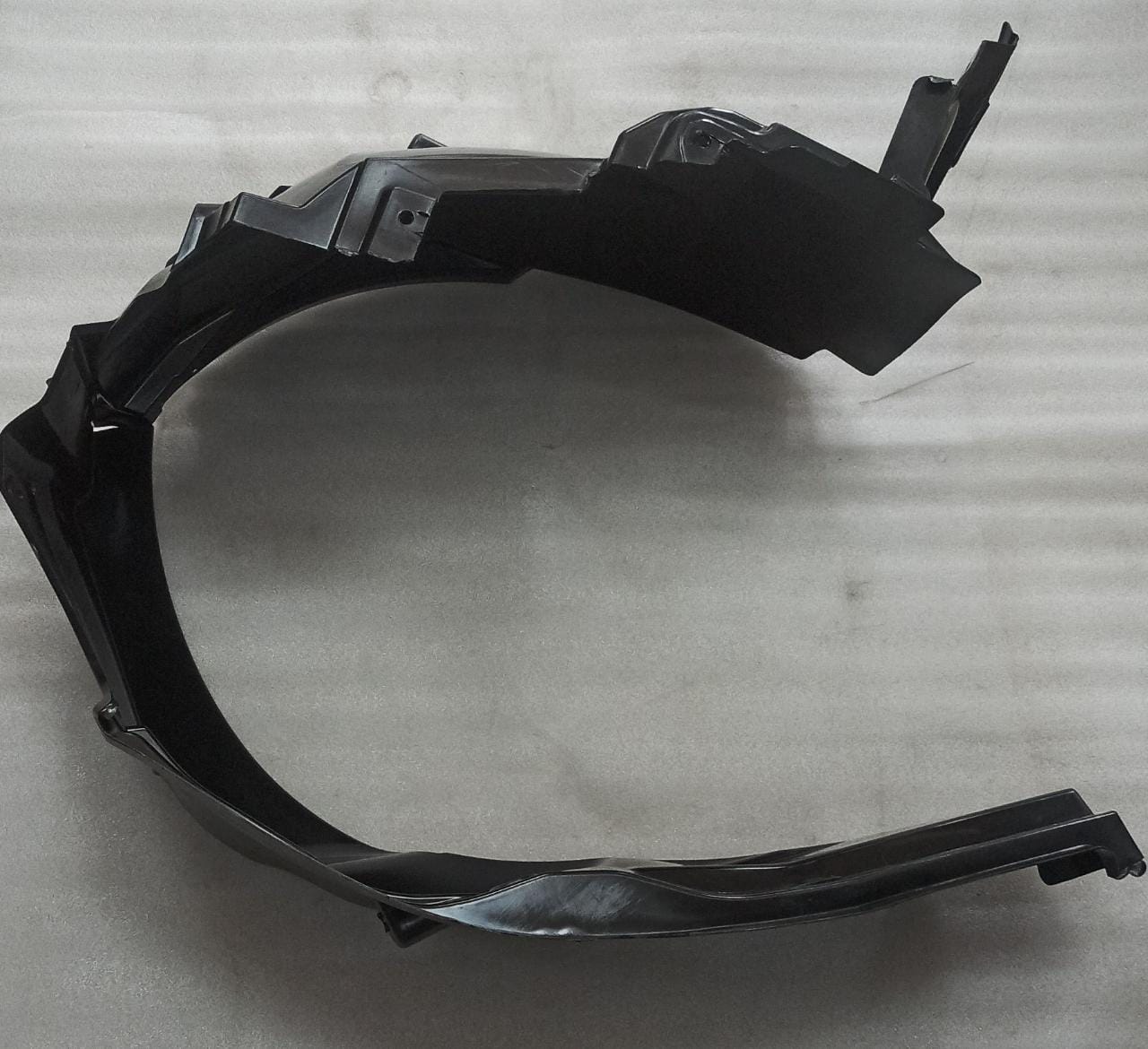 CarTrends left side fender lining for Ertiga, automotive spare part showing the black plastic fender liner.