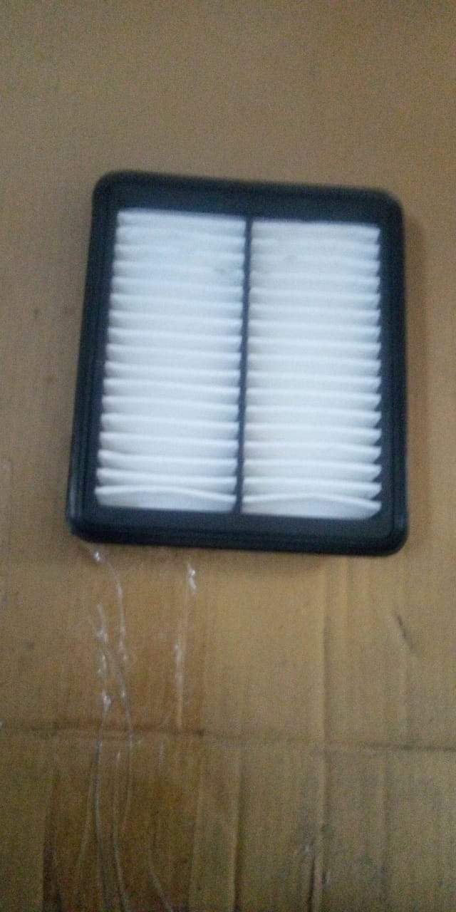 CarTrends EON air filter spare part, rectangular filter with pleated design for engine airflow in vehicle engine compartment.