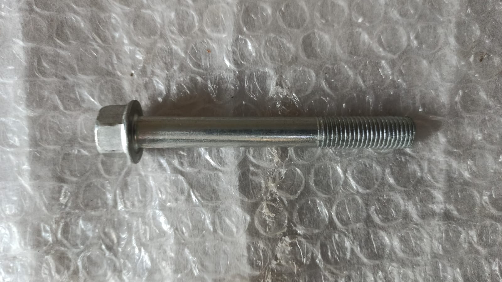 CarTrends bolt bracket for Tavera T94011785, spare parts component, close-up of metal mounting bracket with bolt showing.