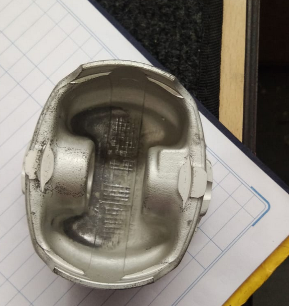 CarTrends Chevrolet Optra 1.6 piston spare part with 0.5mm clearance, close-up view of the engine component.