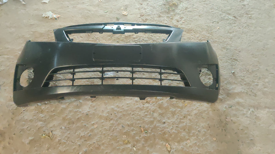 Chevrolet Beat front bumper spare part by CarTrends, showing the new bumper with mounting points and smooth finish.