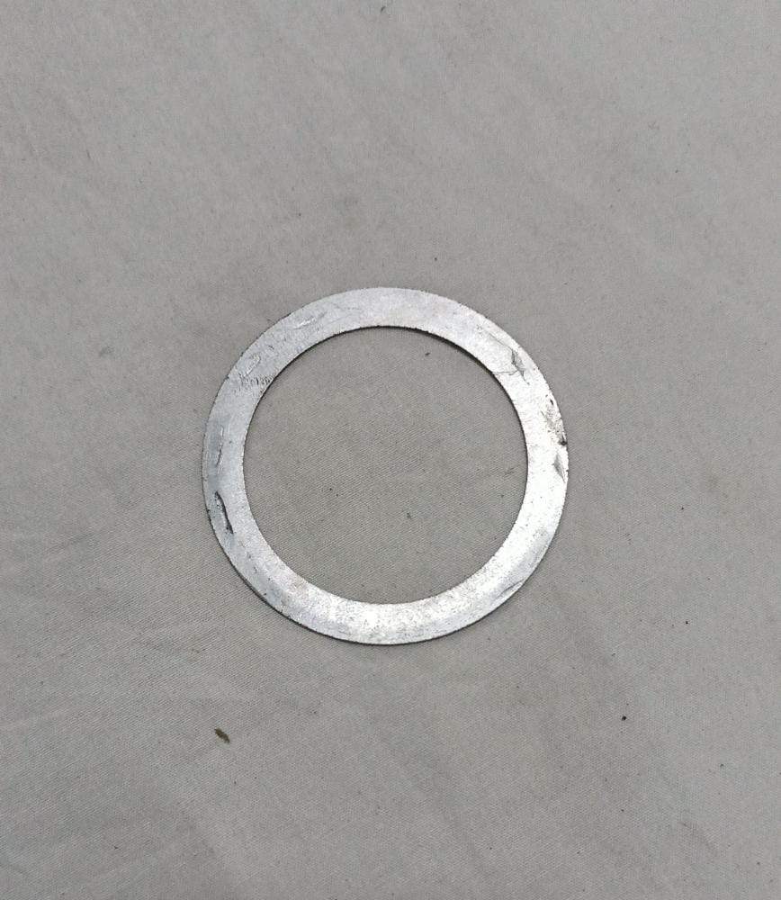 CarTrends differential shim for Tavera, automotive spare part, close-up of the black metal shim used in vehicle differential assembly.