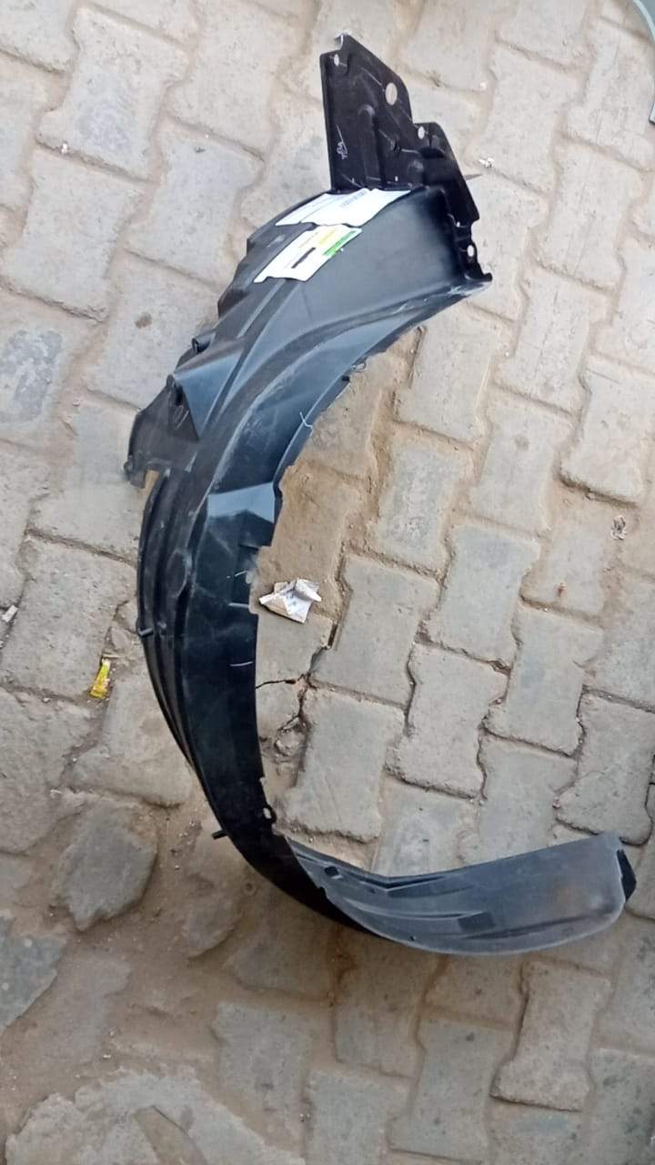 Right Fender Lining for Toyota Innova Crysta, CarTrends spare part, close-up view of the car's right side fender lining.