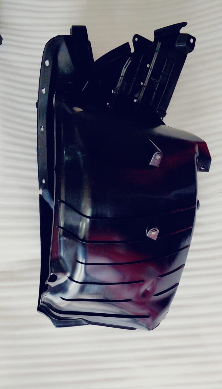 CarTrends Fender Lining Swift LH Side, spare part for vehicle, showing close-up of the black fender liner with mounting edges.