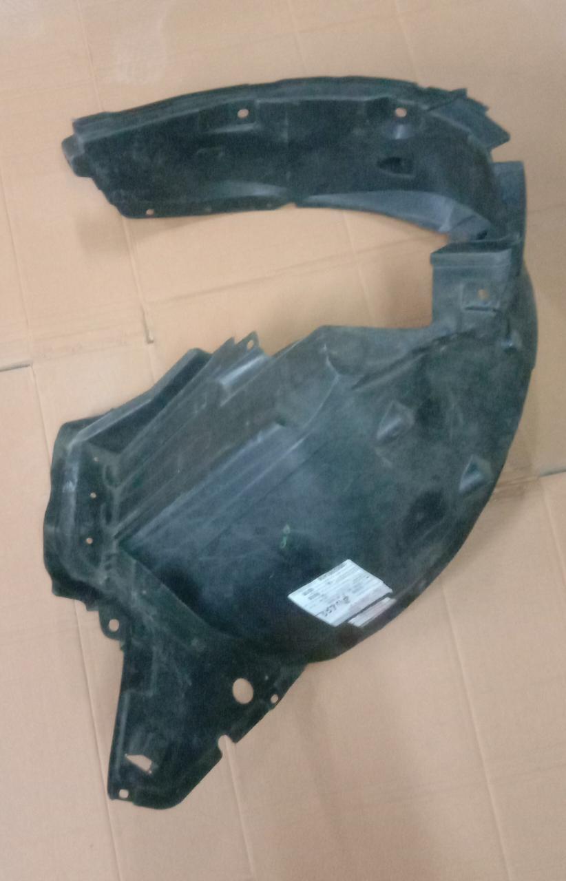 Left front fender lining for Nissan Micra petrol from CarTrends, spare car part showing the underside of the vehicle's front left wheel well.